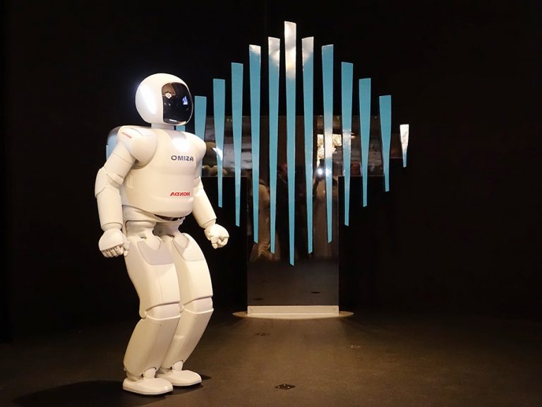 Honda ASIMO robot on stage — a real-time human-robot interaction proof point for Psyclone AIOS
